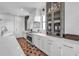 Modern kitchen features stainless steel appliances, white cabinets, and ample counter space, perfect for cooking at 224 Chilson Ave, Anna Maria, FL 34216