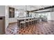 Expansive kitchen with a large island, stylish barstools, and plenty of counter space for food preparation at 224 Chilson Ave, Anna Maria, FL 34216