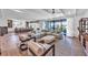 Bright, open-concept living area with modern decor, a ceiling fan, and a view of the outdoors at 224 Chilson Ave, Anna Maria, FL 34216