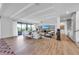 Expansive living room featuring beamed ceilings, tile floors, and comfortable furnishings at 224 Chilson Ave, Anna Maria, FL 34216