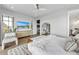 Bright main bedroom featuring a flatscreen TV, ceiling fan, and access to a walk-in closet at 224 Chilson Ave, Anna Maria, FL 34216