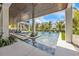 Beautiful pool area with water features, stepping stones, and lush tropical landscaping offering a serene outdoor oasis at 224 Chilson Ave, Anna Maria, FL 34216