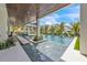Beautiful pool area with water features, stepping stones, and lush tropical landscaping offering a serene outdoor oasis at 224 Chilson Ave, Anna Maria, FL 34216