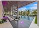 Expansive pool with LED lighting, a modern patio area and professional landscaping at 224 Chilson Ave, Anna Maria, FL 34216
