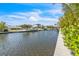 Beautiful waterfront homes line a peaceful canal with boat docks on a sunny day at 224 Chilson Ave, Anna Maria, FL 34216