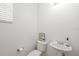 Half bathroom with pedestal sink, toilet and neutral walls at 25364 Tether Ln, Punta Gorda, FL 33983