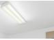 Fluorescent light fixture attached to a flat, white ceiling indoors at 25364 Tether Ln, Punta Gorda, FL 33983