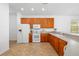 Well-equipped kitchen featuring tile floors, ample cabinet space, and modern appliances at 25364 Tether Ln, Punta Gorda, FL 33983