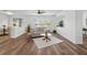 Cozy living room with hardwood floors and a view to the dining room area at 25364 Tether Ln, Punta Gorda, FL 33983