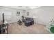 Upstairs living room features a sectional sofa and play tent at 25364 Tether Ln, Punta Gorda, FL 33983