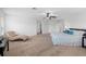 Spacious primary bedroom with a seating area and neutral decor at 25364 Tether Ln, Punta Gorda, FL 33983