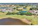 Beautiful aerial view of the golf course with sand bunkers and several tranquil ponds at the Sun City Center Community at 302 Crystal Downs Ct, Sun City Center, FL 33573