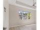 Bright bedroom with a large window showcasing the green view at 302 Crystal Downs Ct, Sun City Center, FL 33573