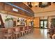 The elegant interior bar area features ample seating and lovely decor at 302 Crystal Downs Ct, Sun City Center, FL 33573