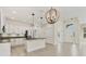 Bright kitchen with stainless steel appliances, granite countertops and a center island at 302 Crystal Downs Ct, Sun City Center, FL 33573