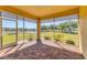 Relaxing screened lanai showcasing brick flooring and beautiful views of the lake and lush green landscape at 302 Crystal Downs Ct, Sun City Center, FL 33573