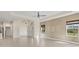 Bright open-concept living room features tile floors and seamless access to a welcoming front entrance at 302 Crystal Downs Ct, Sun City Center, FL 33573