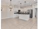 Expansive living area blends seamlessly with kitchen, featuring modern appliances and stylish finishes at 302 Crystal Downs Ct, Sun City Center, FL 33573
