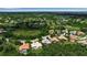 Aerial view featuring an established neighborhood near a golf course, offering both tranquility and recreation at 3738 Eagle Hammock Dr, Sarasota, FL 34240