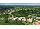 Expansive aerial view of community with access to golf course, picturesque lakes, and lush landscaping at 3738 Eagle Hammock Dr, Sarasota, FL 34240