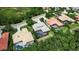 Overhead view of several homes with screened pools in a verdant, well-maintained neighborhood at 3738 Eagle Hammock Dr, Sarasota, FL 34240