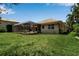 A well-kept lawn with a screened lanai perfect for outdoor relaxation and entertaining at 3738 Eagle Hammock Dr, Sarasota, FL 34240
