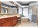 This bathroom showcases a large mirror, double sink vanity, and relaxing tub at 3738 Eagle Hammock Dr, Sarasota, FL 34240