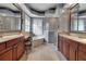 Beautiful bathroom with dual vanities, a soaking tub, a walk-in shower, and refined finishes at 3738 Eagle Hammock Dr, Sarasota, FL 34240