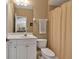 Well-lit bathroom with a vanity, toilet, and shower with curtain at 3738 Eagle Hammock Dr, Sarasota, FL 34240