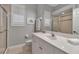 Clean bathroom with walk-in shower, a big mirror and a large vanity at 3738 Eagle Hammock Dr, Sarasota, FL 34240