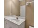 Bright bathroom with a large mirror, vanity, and neutral decor at 3738 Eagle Hammock Dr, Sarasota, FL 34240