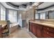 A luxurious bathroom featuring a soaking tub, glass enclosed shower, and marble countertops at 3738 Eagle Hammock Dr, Sarasota, FL 34240