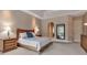 Comfortable bedroom with a tray ceiling, carpeted floors, and matching wood furniture at 3738 Eagle Hammock Dr, Sarasota, FL 34240