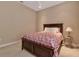 Relaxing bedroom with a comfortable bed, side table, and soft lighting at 3738 Eagle Hammock Dr, Sarasota, FL 34240
