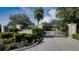The Hammocks gated entrance with well-maintained landscaping and a decorative fountain at 3738 Eagle Hammock Dr, Sarasota, FL 34240