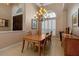 Elegant dining room features a chandelier, neutral walls, and plenty of natural light at 3738 Eagle Hammock Dr, Sarasota, FL 34240