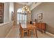 Dining area featuring a chandelier, and a buffet cabinet at 3738 Eagle Hammock Dr, Sarasota, FL 34240