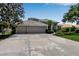 Charming home featuring a three-car garage, well-manicured landscaping, and a tile roof at 3738 Eagle Hammock Dr, Sarasota, FL 34240