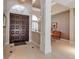 Spacious foyer with tile floors and an arched window offers a glimpse into the dining area at 3738 Eagle Hammock Dr, Sarasota, FL 34240