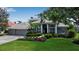 Beautiful single-story home boasts manicured landscaping and a three-car garage at 3738 Eagle Hammock Dr, Sarasota, FL 34240