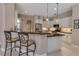 Well-lit kitchen featuring granite counters, stainless appliances, and tile flooring at 3738 Eagle Hammock Dr, Sarasota, FL 34240