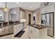 Kitchen features granite countertops, stainless appliances, large island, pantry, and white cabinetry at 3738 Eagle Hammock Dr, Sarasota, FL 34240