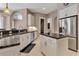 Open kitchen boasts stainless appliances, granite counters, and a central island at 3738 Eagle Hammock Dr, Sarasota, FL 34240