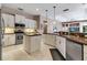 Modern kitchen features stainless appliances, granite countertops, and ample cabinet space at 3738 Eagle Hammock Dr, Sarasota, FL 34240