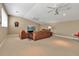 Spacious living room featuring cozy seating arrangements and a large television, perfect for entertainment and relaxation at 3738 Eagle Hammock Dr, Sarasota, FL 34240