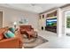 Comfortable living room with leather sofas, a built-in entertainment center, and a neutral color scheme at 3738 Eagle Hammock Dr, Sarasota, FL 34240