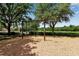 Community playground with classic swing set on wood chip ground covering, perfect for outdoor Gathering fun at 3738 Eagle Hammock Dr, Sarasota, FL 34240