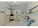 Bright bedroom that also doubles as office space with built in shelves and drawers at 410 Wellington, Venice, FL 34292
