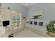Comfortable bedroom that also doubles as office space with built in shelves and drawers at 410 Wellington, Venice, FL 34292