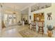 Elegant entrance with a stained-glass double door, and an open view to the kitchen and dining area at 410 Wellington, Venice, FL 34292
